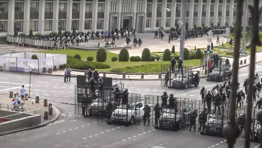 In this video grab taken from a footage provided by Belsat TV via the Associated Press Television, riot police line up to block a street near Independence Square to protect against Belarusian oppositi ...