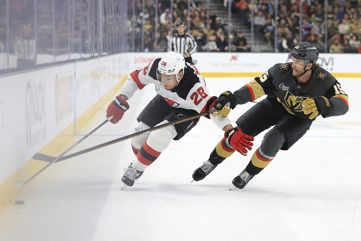 New Jersey Devils right wing Timo Meier (28) skates past Vegas Golden Knights defenseman Noah Hanifin (15) during the first period of an NHL hockey game Sunday, March 2, 2025, in Las Vegas. (AP Photo/ ...