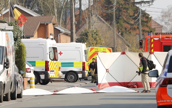 epa09837572 The cordoned off scene in Strepy Bracquegnies, Belgium, 20 March 2022. Six people lost their lives and 26 were injured in the morning, when a car rammed in a carnival crowd. EPA/JULIEN WAR ...
