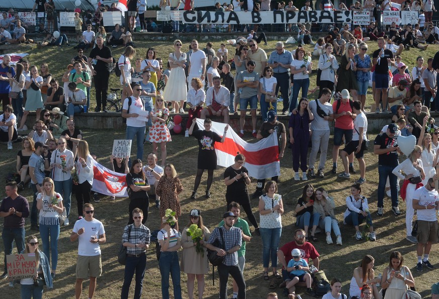 epa08606047 Belarusians react during a rally in support of the Belarusian opposition, against police brutality and the results of the Belarusian presidential election in Minsk, Belarus, 15 August 2020 ...