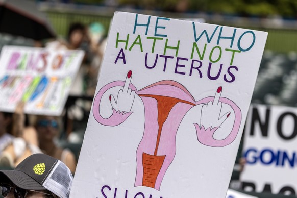 epa11604541 Supporters of the reproduction freedom show signs as they attend the rally &#039;Our Bodies Our Lives&#039; organized by Florida Democratic Party in Miami, Florida, USA, 14 September 2024. ...