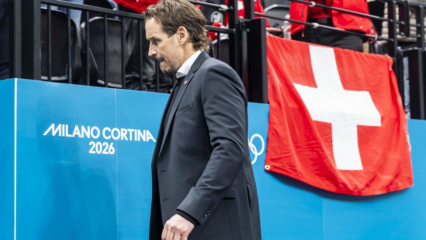 Patrick Fischer, head coach of Switzerland national ice hockey team, looks disappointed as they leave his bench after the second period, during the men's group A preliminary round game between Ca ...
