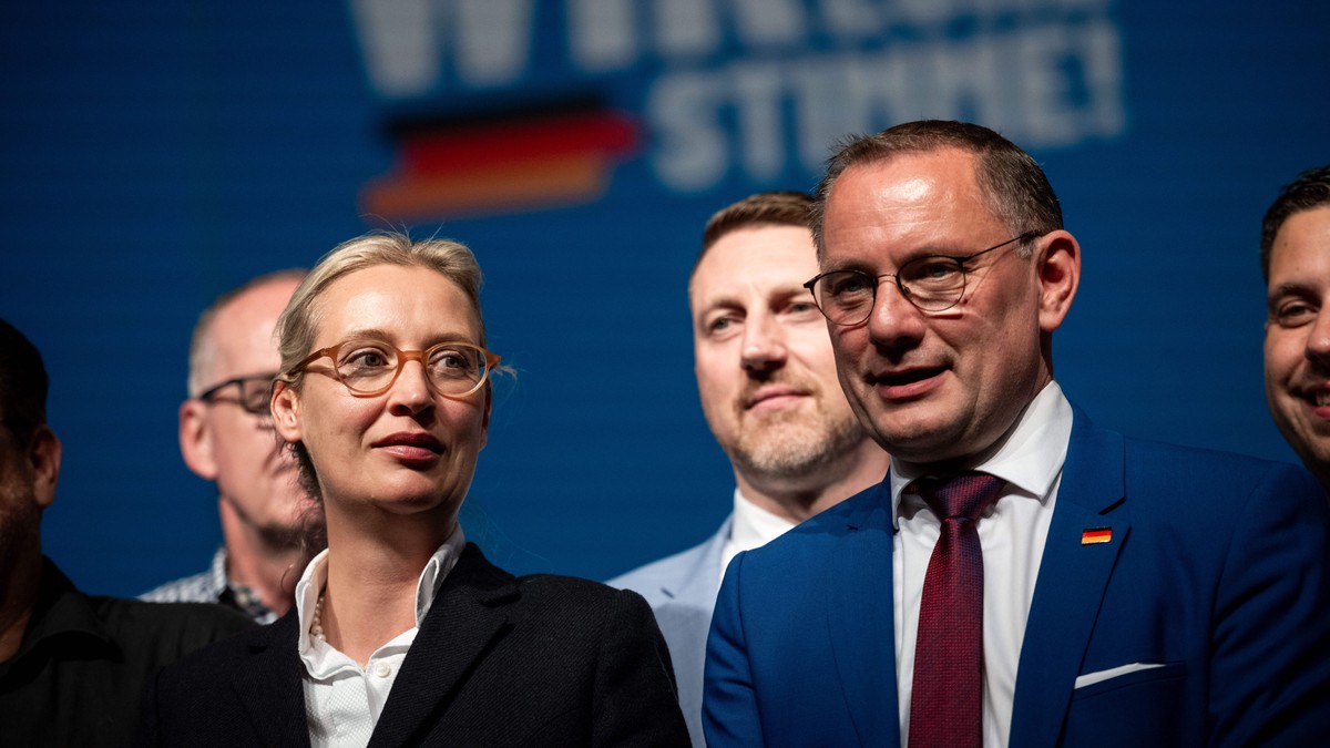 epa11445359 AfD party and faction co-chairwoman Alice Weidel (L) and AfD co-chairman Tino Chrupalla (R) attend the Alternative for Germany (AfD) conference in Essen, Germany, 29 June 2024. The AfD is  ...