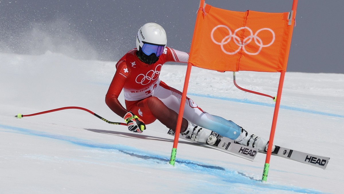 Lara Gut-Behrami, of Switzerland makes a turn during the women's downhill at the 2022 Winter Olympics, Tuesday, Feb. 15, 2022, in the Yanqing district of Beijing. (AP Photo/Alessandro Trovati)