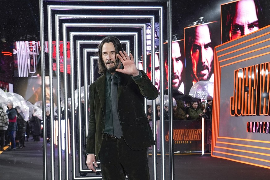 Keanu Reeves poses for photographers upon arrival at the premiere of the film &#039;John Wick Chapter 4&#039;, Monday, March 6, 2023 in London. (Alberto Pezzali/Invision/AP)
Keanu Reeves