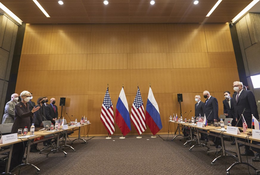 US Deputy Secretary of State Wendy Sherman, left, and Russian deputy Foreign Minister Sergei Ryabkov, right, attend security talks at the United States Mission at the United States Mission in Geneva,  ...