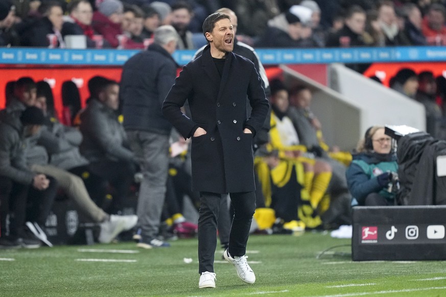 Leverkusen&#039;s head coach Xabi Alonso reacts during the German Bundesliga soccer match between Bayer Leverkusen and Borussia Dortmund at the BayArena in Leverkusen, Germany, Germany, Sunday, Jan. 2 ...