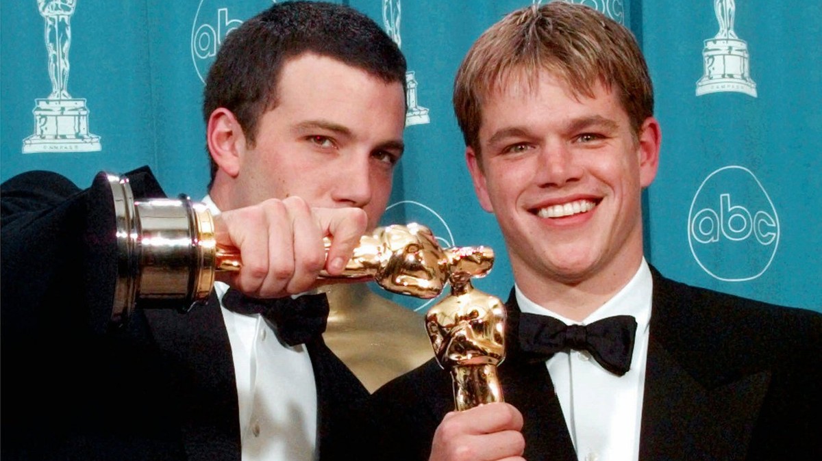 FILE - In this March 23, 1998 file photo, Ben Affleck, left, and Matt Damon display their Oscars for Best Original Screenplay for "Good Will Hunting,"at the 70th Academy Awards at the Shrine ...