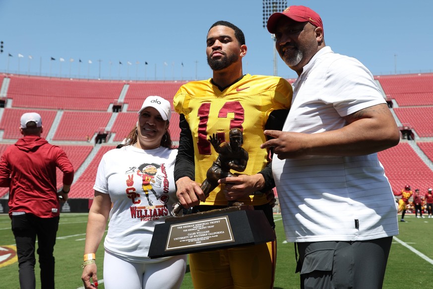 NCAA, College League, USA Football: Southern California Spring Game Apr 15, 2023 Los Angeles, CA, USA USC Trojans quarterback Caleb Williams 13 holds the Heisman Trophy with his parents during the Spr ...