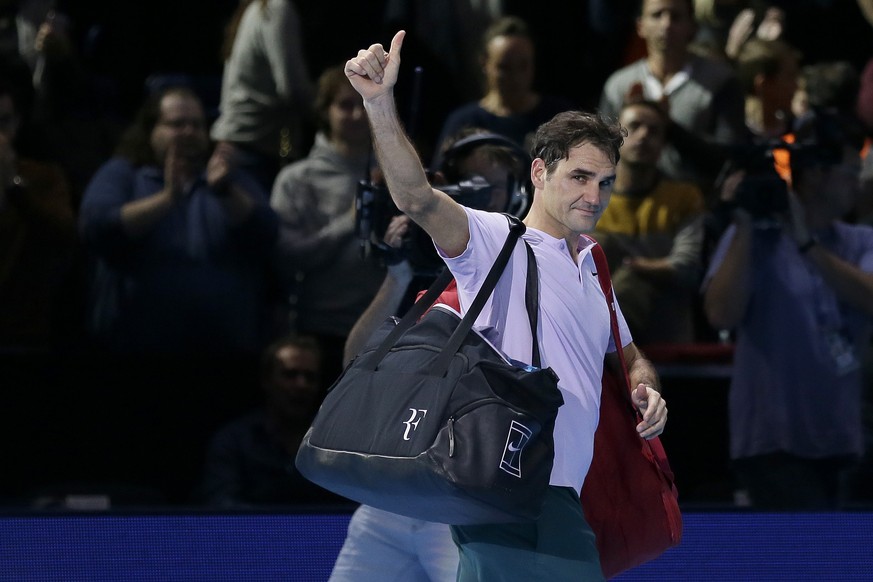 Roger Federer of Switzerland walks off the court after losing to David Goffin of Belgium in their ATP World Tour Finals semifinal tennis match at the O2 Arena in London, Saturday Nov. 18, 2017. (AP Ph ...