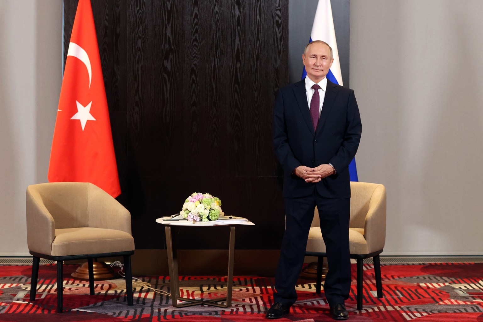 Russian President Vladimir Putin stands waiting for his meeting with Turkey's President Recep Tayyip Erdogan on the sidelines of the Shanghai Cooperation Organisation (SCO) summit in Samarkand, Uzbeki ...