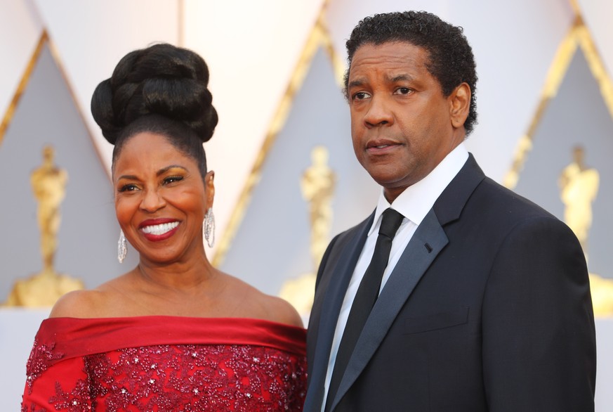 89th Academy Awards - Oscars Red Carpet Arrivals - Hollywood, California, U.S. - 26/02/17 - Denzel Washington and Pauletta Washington arrive REUTERS/Mike Blake