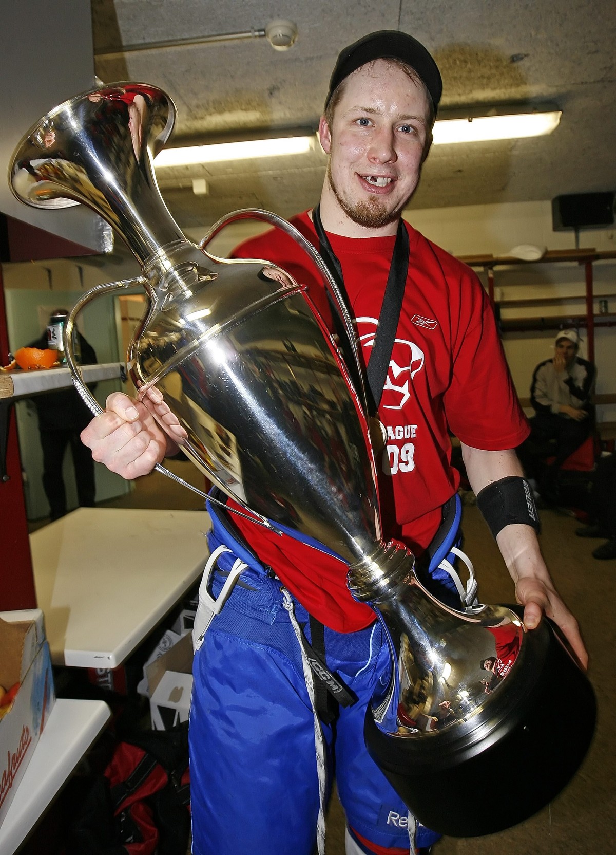 ZSC Lions defensman Mathias Seger poses with the 'Silver Stone' trophy in the locker room after ZSC's victory in the ice hockey Champions League second leg final game between ZSC Lions  ...