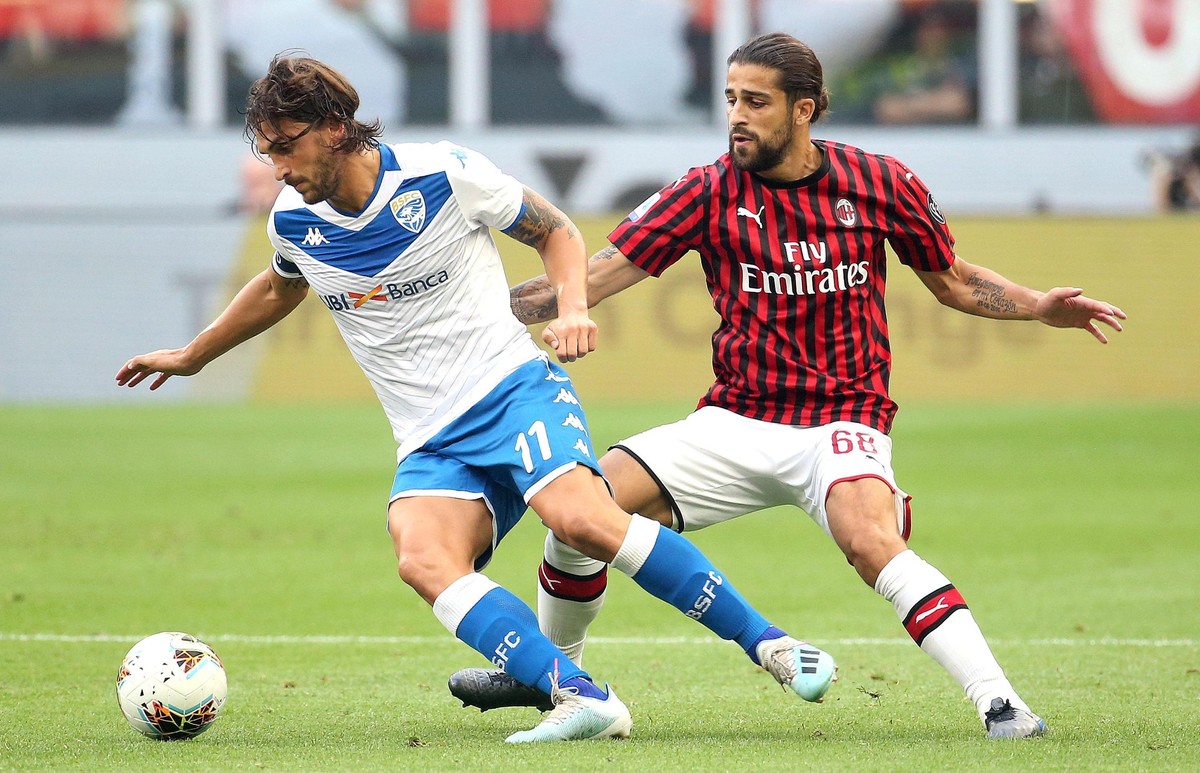 AC Milan's Ricardo Rodriguez and Brescia's Ernesto Torregrossa, left, go for the ball during the Italian Serie A soccer match between AC Milan and Brescia Calcio at the San Siro Stadium in M ...