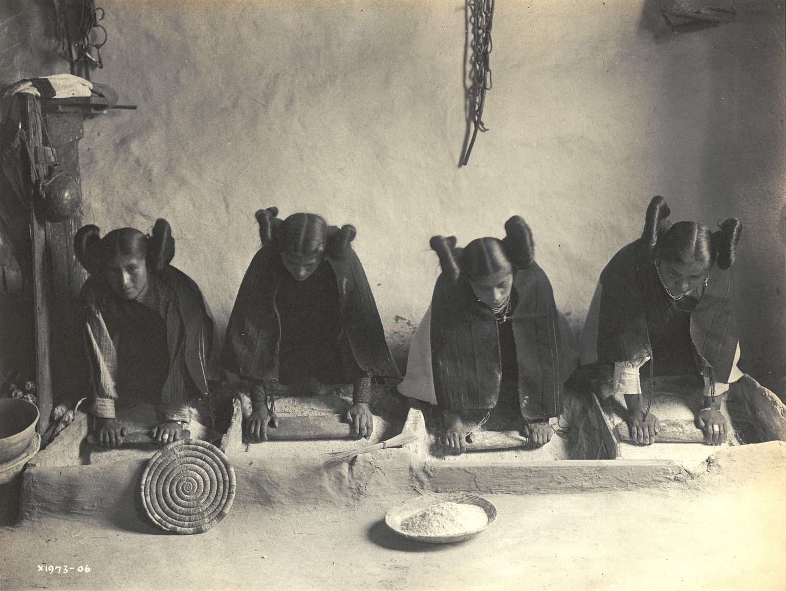 The Mealing Trough - Hopi by Edward S Curtis (American, 1868-1952), showing four young Hopi women grinding corn (silver print), 1906. (Photo by GraphicaArtis/Getty Images)