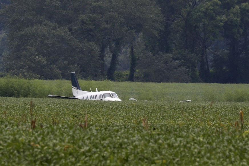 A stolen airplane rests in a field of soybeans after crash-landing near Ripley, Miss., on Saturday, Sept. 3, 2022. Authorities say a man who stole a plane and flew it over Mississippi after threatenin ...