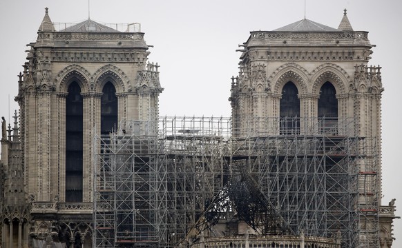 View of the scaffolding and damaged Notre Dame cathedral after the fire in Paris, Tuesday, April 16, 2019. Experts are assessing the blackened shell of Paris&#039; iconic Notre Dame cathedral to estab ...