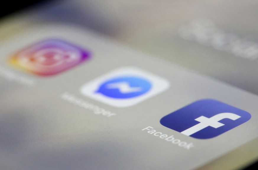 FILE- In this March 13, 2019, file photo Facebook, Messenger and Instagram apps are are displayed on an iPhone in New York. Facebook, Instagram and WhatsApp are down. 
All three social media platforms ...