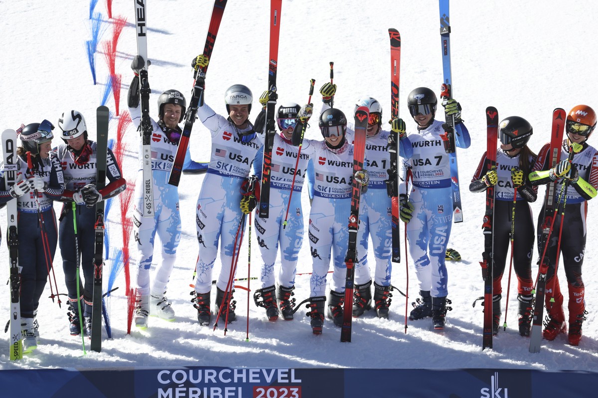 United States' team celebrates winning gold in an alpine ski, mixed team parallel event, at the World Championships, in Meribel, France, Tuesday, Feb. 14, 2023. (AP Photo/Alessandro Trovati)