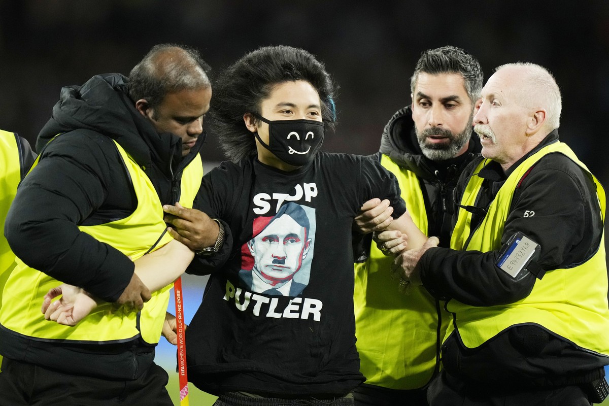 Security detain pitch invader wearing a t-shirt with an image showing Russian President Vladimir Putin as late German dictator Adolf Hitler during the final of Women's World Cup soccer between Sp ...