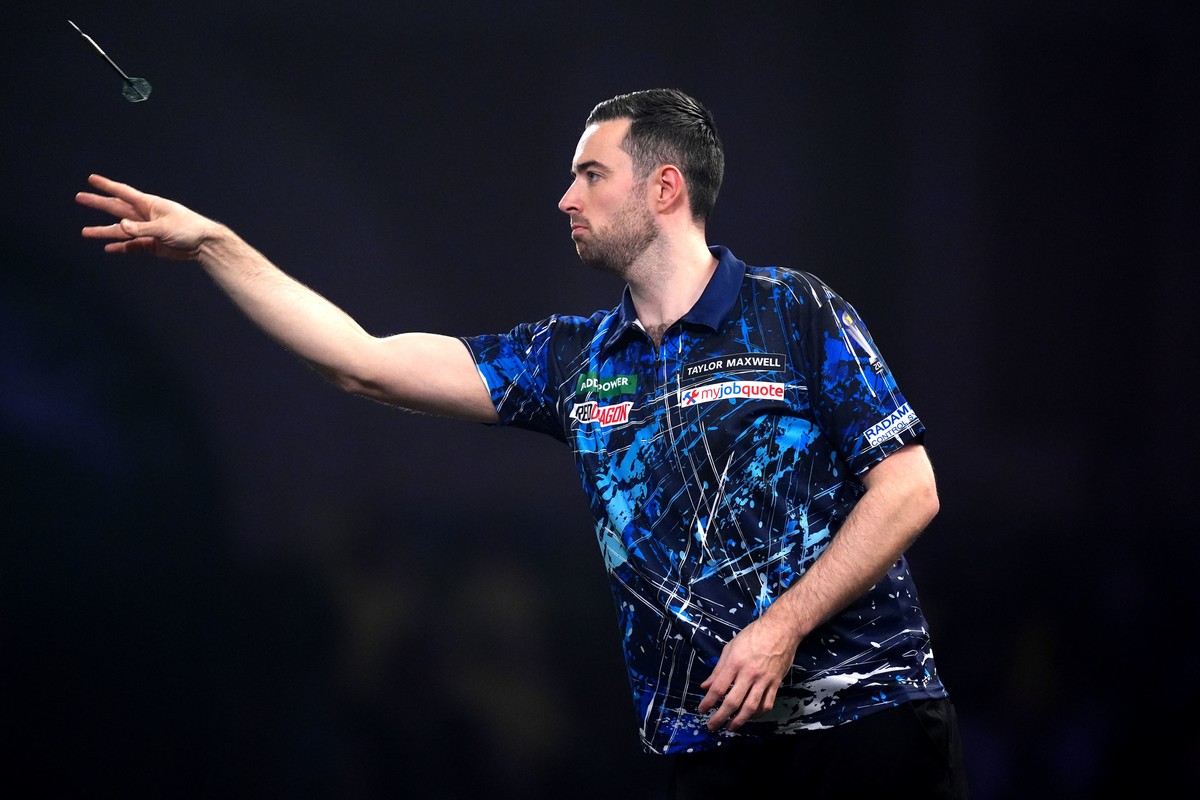 England's Luke Humphries during his match against Germany's Gabriel Clemens on day fifteen of the World Darts Championship in London, Sunday, Dec. 28, 2025. (John Walton/PA via AP)
Britain W ...