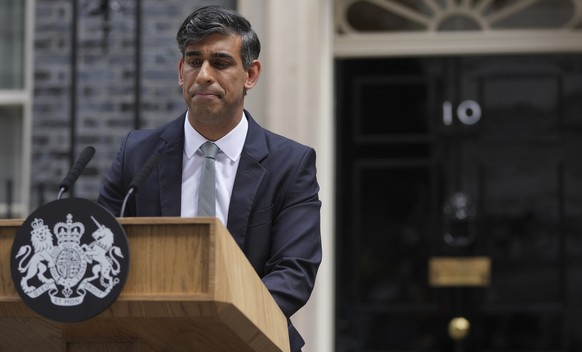 Britain&#039;s outgoing Conservative Party Prime Minister Rishi Sunak looks down as he makes a short speech outside 10 Downing Street before going to see King Charles III to tender his resignation in  ...