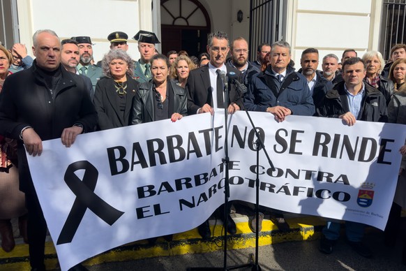 epa11142494 People holding a banner that reads 'Barbate will not surrender.  Barbate against drug trafficking' will observe a minute's silence on February 10, 2024 in the city of Barbate in the province of Cádiz, ...