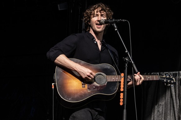 epa11540416 Australian musician Dean Lewis performs on the Boegescenen stage during Smukfest festival in Skanderborg, Denmark, 09 August 2024. EPA/HELLE ARENSBAK DENMARK OUT