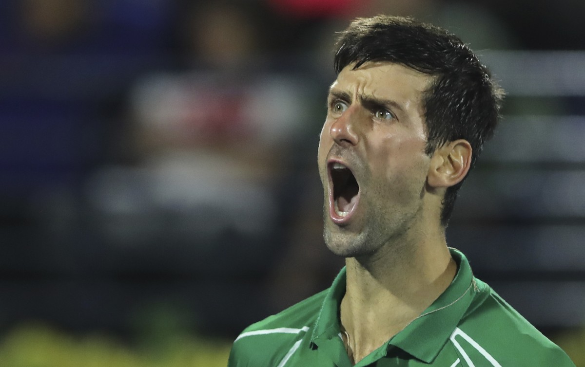Serbia's Novak Djokovic reacts after he got a point against Stefanos Tsitsipas of Greece during the final match of the Dubai Duty Free Tennis Championship in Dubai, United Arab Emirates, Saturday ...