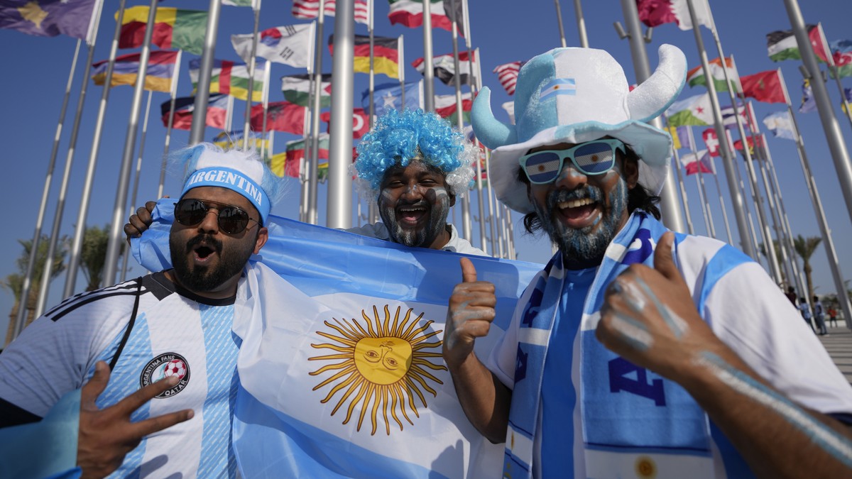 Fans from Argentina cheer as they pose for a picture at flag plaza in Doha, Qatar, Friday, Nov. 11, 2022. Final preparations are being made for the soccer World Cup which starts on Nov. 20 when Qatar  ...
