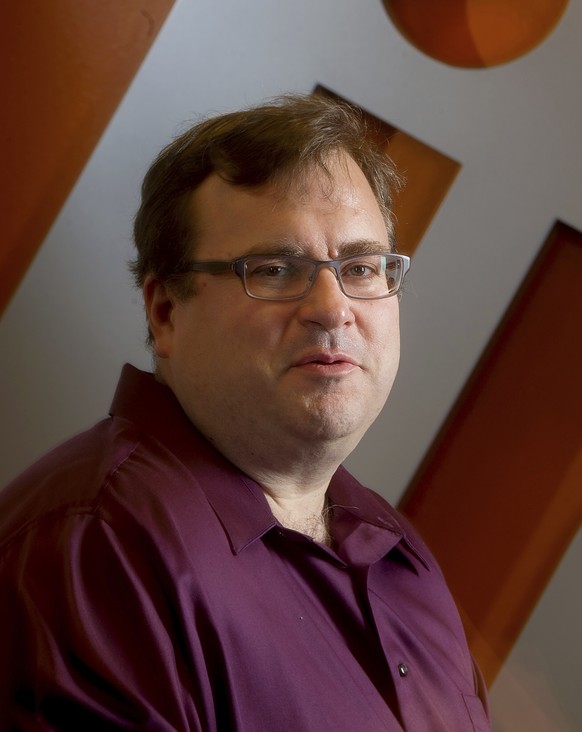 FILE - LinkedIn co-founder Reid Hoffman sits in the lobby of LinkedIn&#039;s Mountain View, Calif., headquarters on Tuesday, May 7, 2013. (AP Photo/Noah Berger, File)