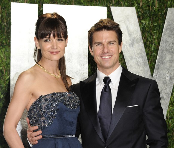 FILE - In this Feb. 26, 2012 file photo, actors Tom Cruise and Katie Holmes arrive at the Vanity Fair Oscar party, in West Hollywood, Calif. Court records filed in a New York City court indicate the c ...