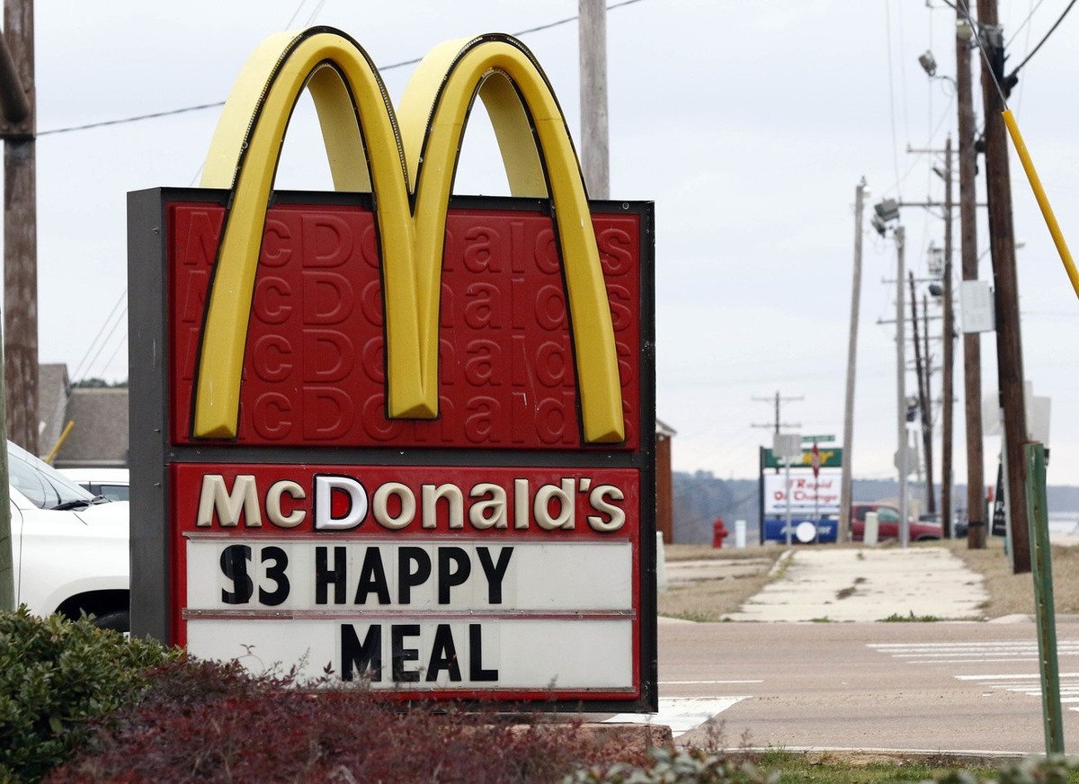 A $3 Happy Meal is advertised at a Brandon, Miss., McDonald's Restaurant, Wednesday, Feb. 14, 2018. McDonald's will undergo some changes as the cheeseburger choice and chocolate milk will be ...