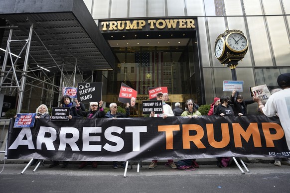 FILE - Protesters gather outside Trump Tower on Friday, March 31, 2023, in New York. Former President Donald Trump was indicted by a Manhattan grand jury the day before, an historic reckoning after ye ...
