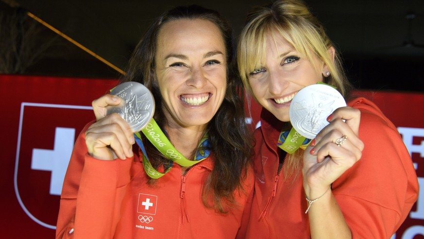 Timea Bacsinszky, right, and Martina Hingis, left, pose with their silver medal in the women’s Tennis Doubles tournament during a medal celebration celebrating in the House of Switzerland at the Rio 2 ...