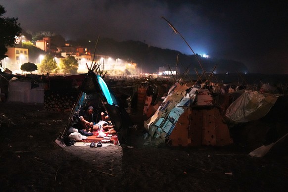 Migrants sit inside their tents at El Trampolín beach in the Spanish exclave of Ceuta, Wednesday, Sept. 2, 2026. (AP Photo/Francis González)
APTOPIX Spain Ceuta