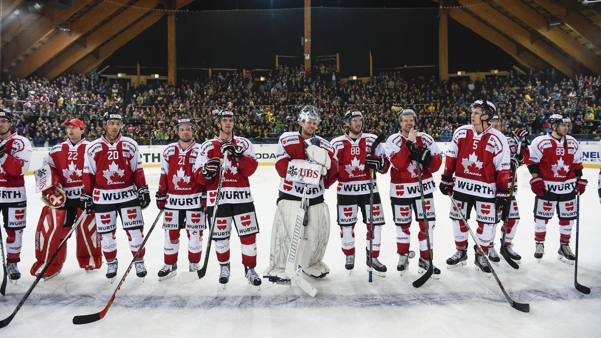 Players of Team Canada line up after winning the game between Team Canada and Switzerland's HC Davos, at the 89th Spengler Cup ice hockey tournament in Davos, Switzerland, on Monday, December 28, ...