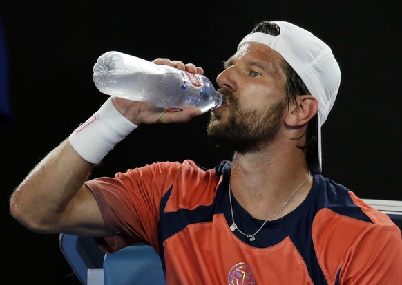 Austria&#039;s Jurgen Melzer takes a drink during his match against Switzerland&#039;s Roger Federer at the Australian Open tennis championships in Melbourne, Australia, Monday, Jan. 16, 2017. (AP Pho ...