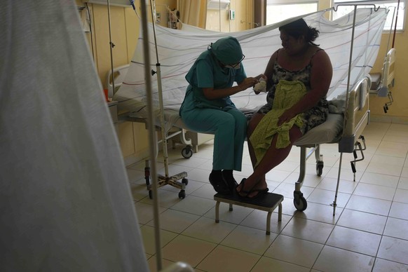 A nurse attends to a patient suffering from dengue at La Merced Hospital in Paita, Peru, Thursday, February 29, 2024. Peru declared a health emergency in most provinces on February 26 due to a growing…