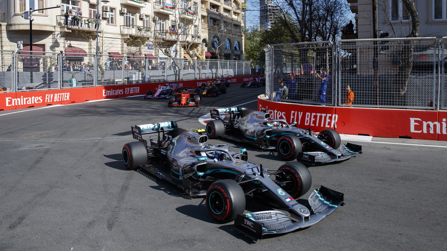 epa07534119 Finnish Formula One driver Valtteri Bottas of Mercedes AMG GP (L) and British Formula One driver Lewis Hamilton of Mercedes AMG GP (R) in action during the start of the 2019 Formula One Gr ...