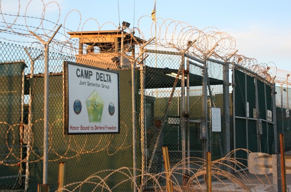 FILE - This Oct. 24, 2010, file photo shows the entrance to Camp Delta at Guantanamo Bay. Six men long held at Guantanamo Bay arrived Saturday, June 13, 2015, in Oman, the first movement of detainees  ...