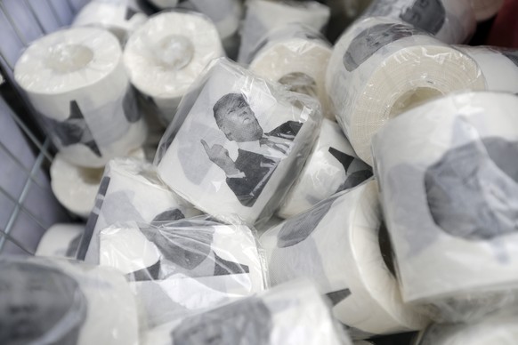 Rolls of toilet paper with pictures of US President Donald Trump being sold on the street during a Peoples Vote anti-Brexit march in London, Saturday, March 23, 2019. The march, organized by the Peopl ...