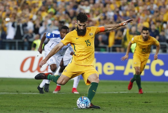 FILE - In this Wednesday, Nov. 15, 2017 filer, Australia&#039;s Mile Jedinak scores his second goal against Honduras during their World Cup soccer playoff deciding match in Sydney, Australia. (AP Phot ...