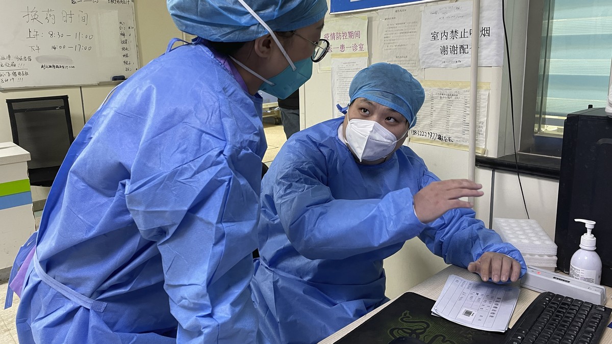Hospital workers discuss their work at the emergency department of Baigou New Area Aerospace Hospital in Baigou, in northern China's Hebei province on Thursday, Dec. 22, 2022. As China grapples w ...