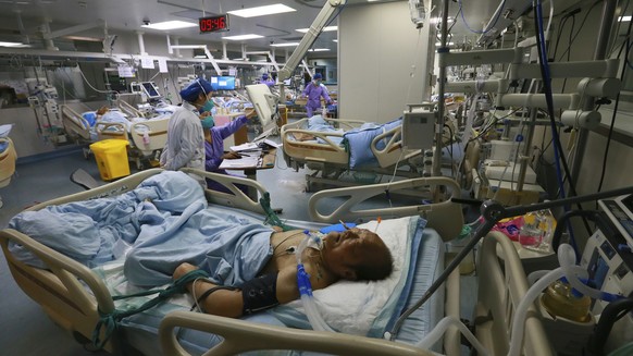 A patient lies on a bed in the ICU ward of a hospital in Suining in southwestern China&#039;s Sichuan province on Saturday, Dec. 31, 2022. China is on a bumpy road back to normal life as schools, shop ...