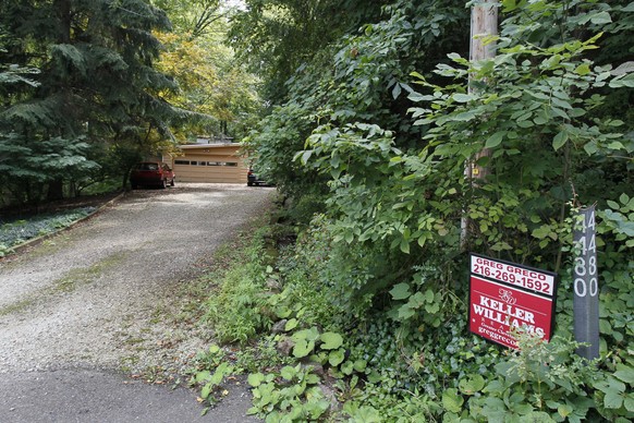 FILE - In this Aug. 12, 2012 file photo,the West Bath Road childhood home of Jeffrey Dahmer is shown in Bath Twp., Ohio. The house where Dahmer grew up and committed his first murder is for sale in Oh ...