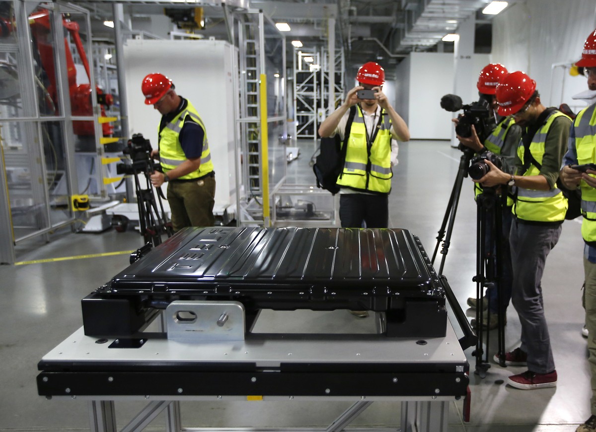 FILE - A Tesla battery pack is displayed during a media tour of the new Tesla Motors Inc., Gigafactory Tuesday, July 26, 2016, in Sparks, Nev. (AP Photo/Rich Pedroncelli, File)
Tesla Battery Productio ...