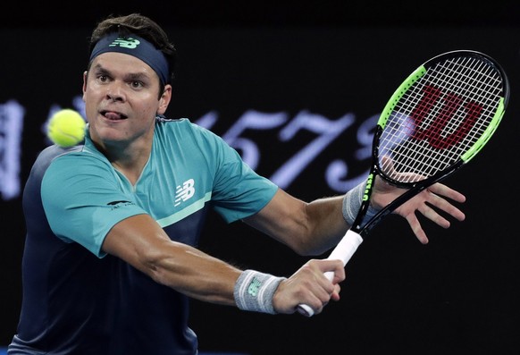 Canada&#039;s Milos Raonic plays a backhand return to Australia&#039;s Nick Kyrgios during their first round match at the Australian Open tennis championships in Melbourne, Australia, Tuesday, Jan. 15 ...