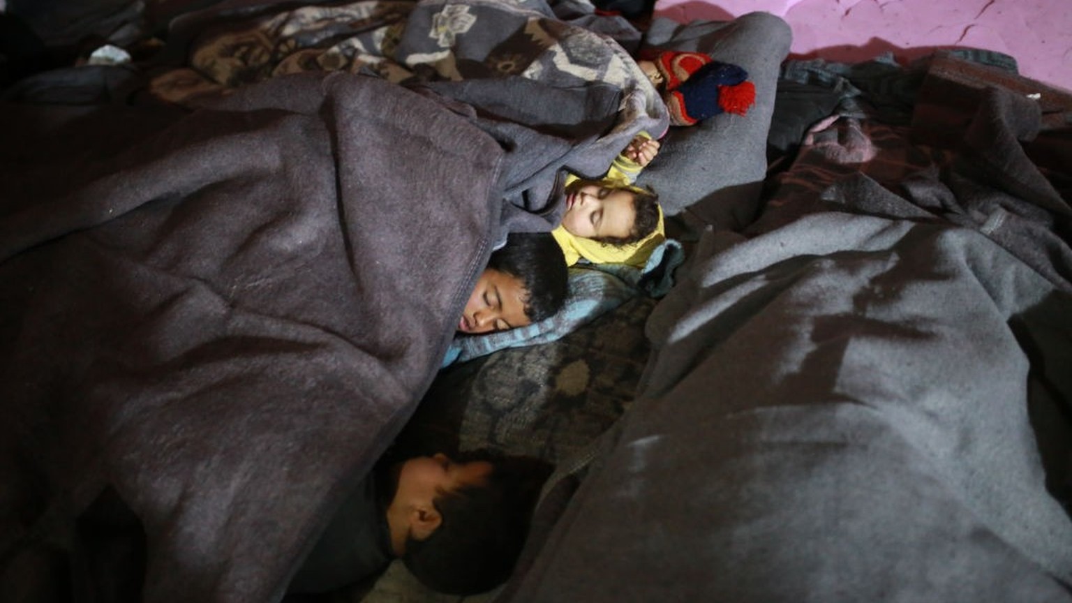 IDLIB, SYRIA - FEBRUARY 13: Children sleep as earthquake survivors live in tent after amusement park turns into a shelter for earthquake victims in Idlib, Syria on February 13, 2023. Families which th ...