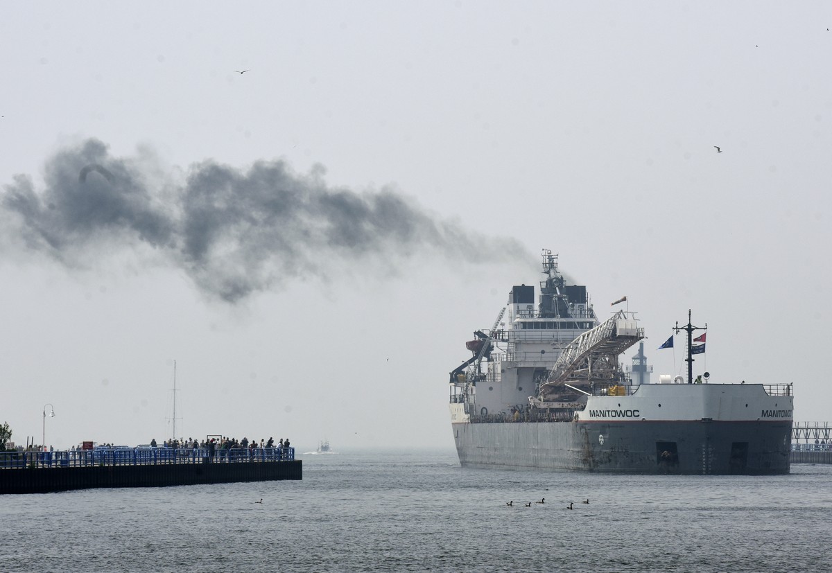 A haze from Canadian wildfires lingers over Lake Michigan as the freighter Manitowoc docks Wednesday, June 28, 2023, in St. Joseph, Mich.(Don Campbell/The Herald-Palladium via AP)